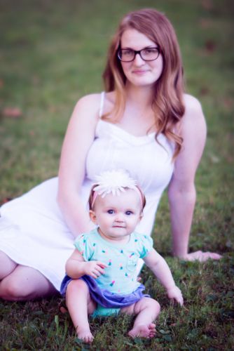 Mother and daughter sitting in the park